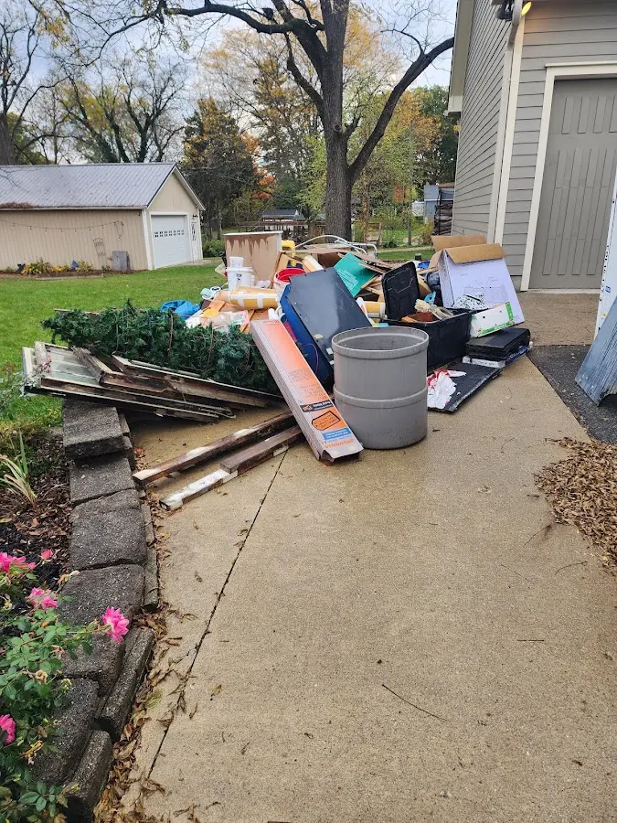 Dumpster being loaded with debris for Commercial Dumpster Rental in Eastland